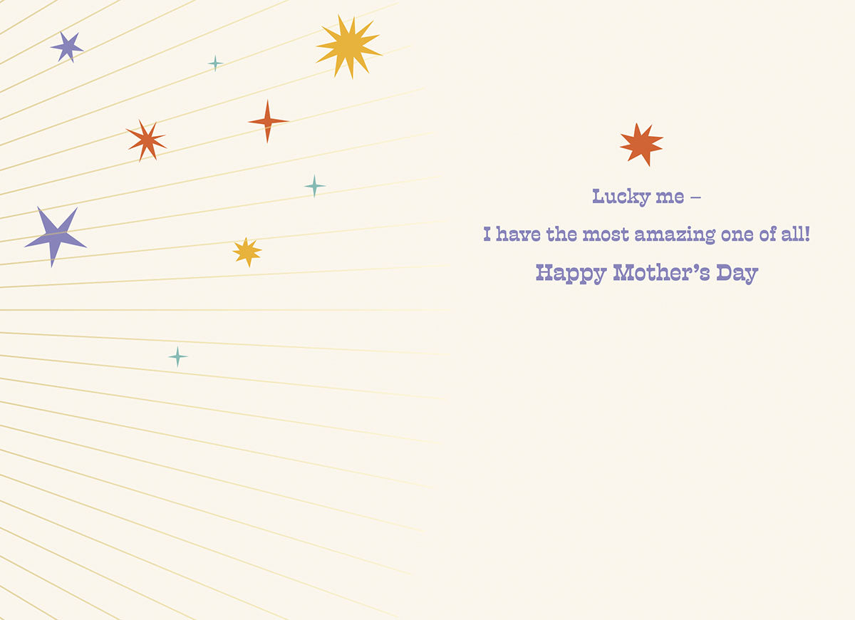 Inside of a Mother's Day greeting card with a light background and subtle starburst design. Text reads "Lucky me - I have the most amazing one of all! Happy Mother's Day" in an elegant purple font, surrounded by small colorful stars.