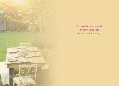Inside of Mother's Day card, featuring the outdoor table scene fading into a warm background with a heartfelt message.