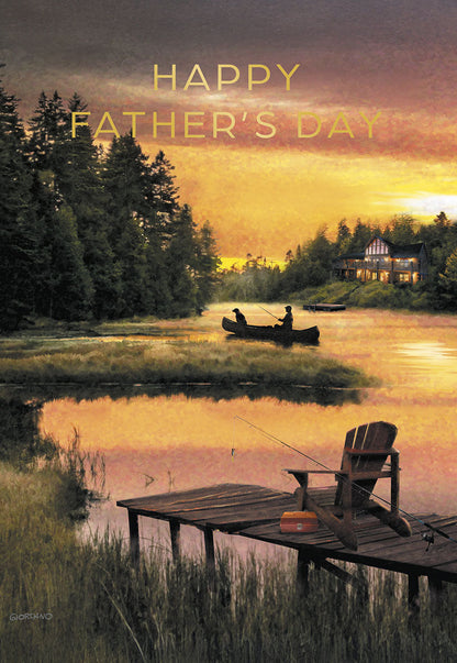 A serene Father's Day card showing a man and his dog fishing from a canoe on a calm lake at sunset, with a rustic cabin and pine trees.