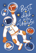Astronaut dad greeting card with 'Best dad in the Universe' text, featuring a cartoon spaceman holding a football, surrounded by objects like a baby bottle, donut, baseball cap, and video game controller against a starry blue background.