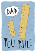 Funny greeting card for dad featuring two smiling cartoon rulers, a large 'DAD' ruler and a smaller ruler, on a light blue starry background with the pun 'DAD YOU RULE' in black lettering.