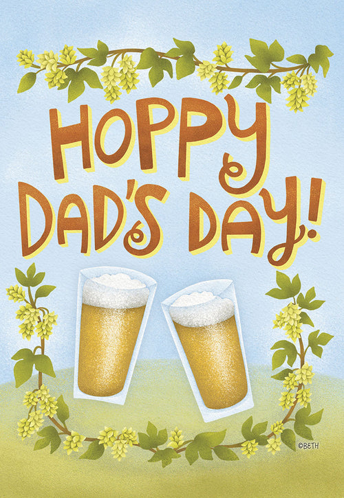 Front of a light blue greeting card with "Hoppy Dad's Day!" in playful brown text. Two frothy beer glasses clink in the center, framed by vibrant green hop vines with yellow cones.