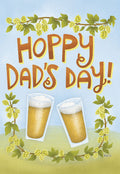 Front of a Father's Day greeting card featuring 'Hoppy Dad's Day!' text, two clinking beer glasses, and decorative hop vines, perfect for a dad who loves craft beer.