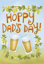 Front of a Father's Day greeting card featuring 'Hoppy Dad's Day!' text, two clinking beer glasses, and decorative hop vines, perfect for a dad who loves craft beer.