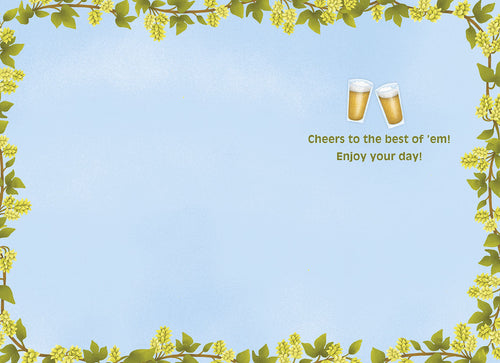 Inside of a light blue greeting card, featuring a decorative border of green hop vines with yellow cones. A small message reads "Cheers to the best of 'em! Enjoy your day!" with two tiny beer glasses above.