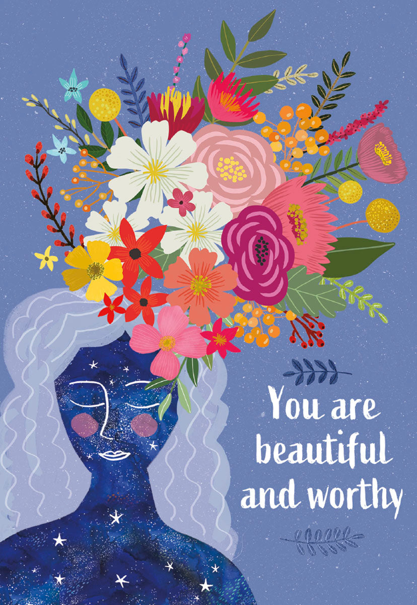 Front of a Mia Charro 'You Are Beautiful and Worthy' card, depicting a cosmic woman with a vibrant floral crown.