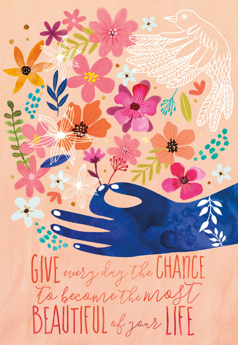 Front of a Mia Charro 'Give Every Day the Chance' card, with a hand holding a burst of colorful flowers and a bird.