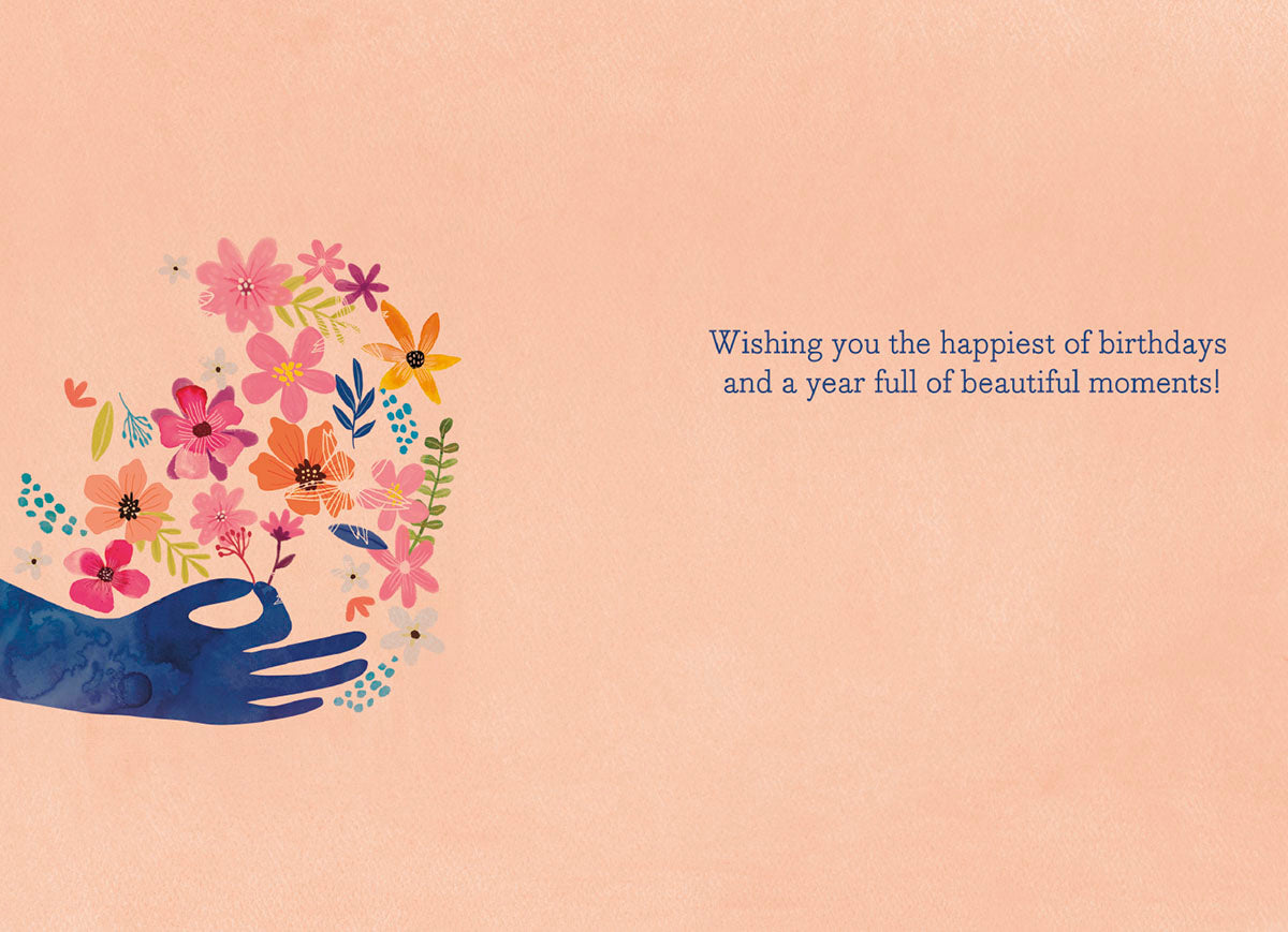 Inside of a Mia Charro 'Give Every Day the Chance' card, with a peach background and a wish for a beautiful birthday.