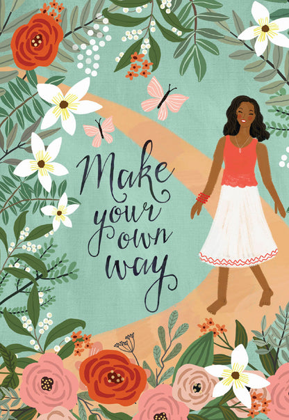 Front of a Mia Charro 'Make Your Own Way' card, featuring a woman on a path surrounded by vibrant flowers and butterflies.
