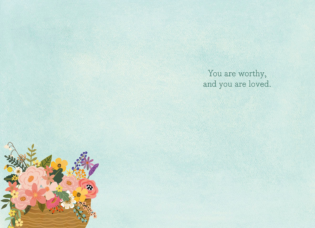 Inside of a Mia Charro 'You Are Enough' card, with a light blue background and a message of self-worth.