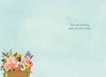 Inside of a Mia Charro 'You Are Enough' card, with a light blue background and a message of self-worth.