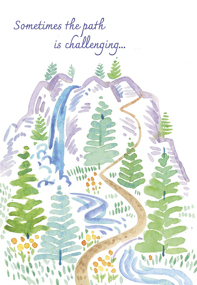 Front of an encouraging card: 'Sometimes the path is challenging...' illustrated with a winding mountain trail, waterfall, and trees.