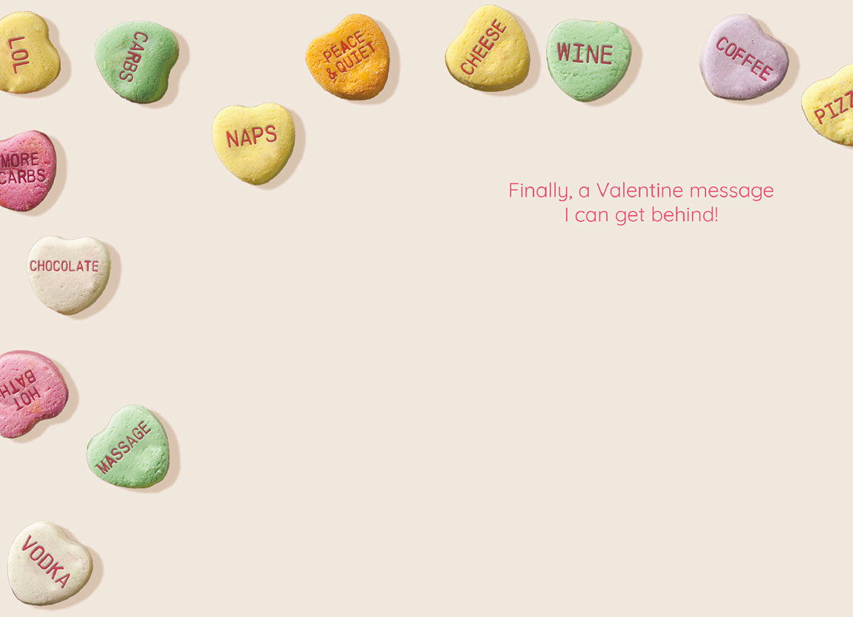 Funny Valentine's Day greeting card design with a border of pastel conversation hearts displaying adult desires, and the central red text 'Finally, a Valentine message I can get behind!' on a light background.