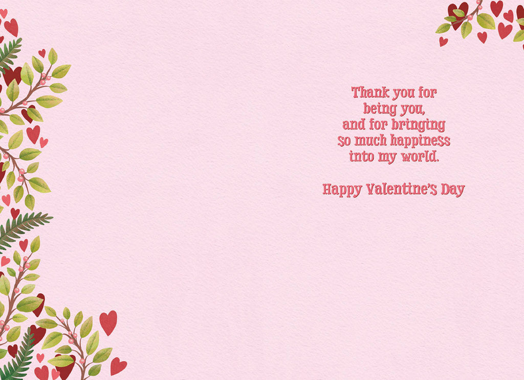 Inside of a romantic Valentine's Day greeting card with a light pink textured background. The right side displays the message 'Thank you for being you, and for bringing so much happiness into my world. Happy Valentine's Day' in elegant red script. Green leafy branches with red hearts and berries adorn the left side and top edge.