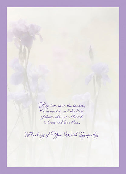 Inside of a sympathy card with a faint floral background and heartfelt message about cherished memories and love.
