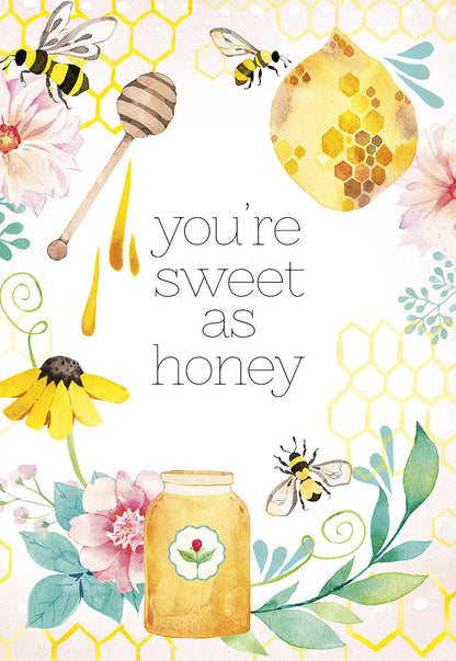 Close-up of "You're sweet as honey" greeting card with watercolor bees, flowers, and honeycomb patterns.