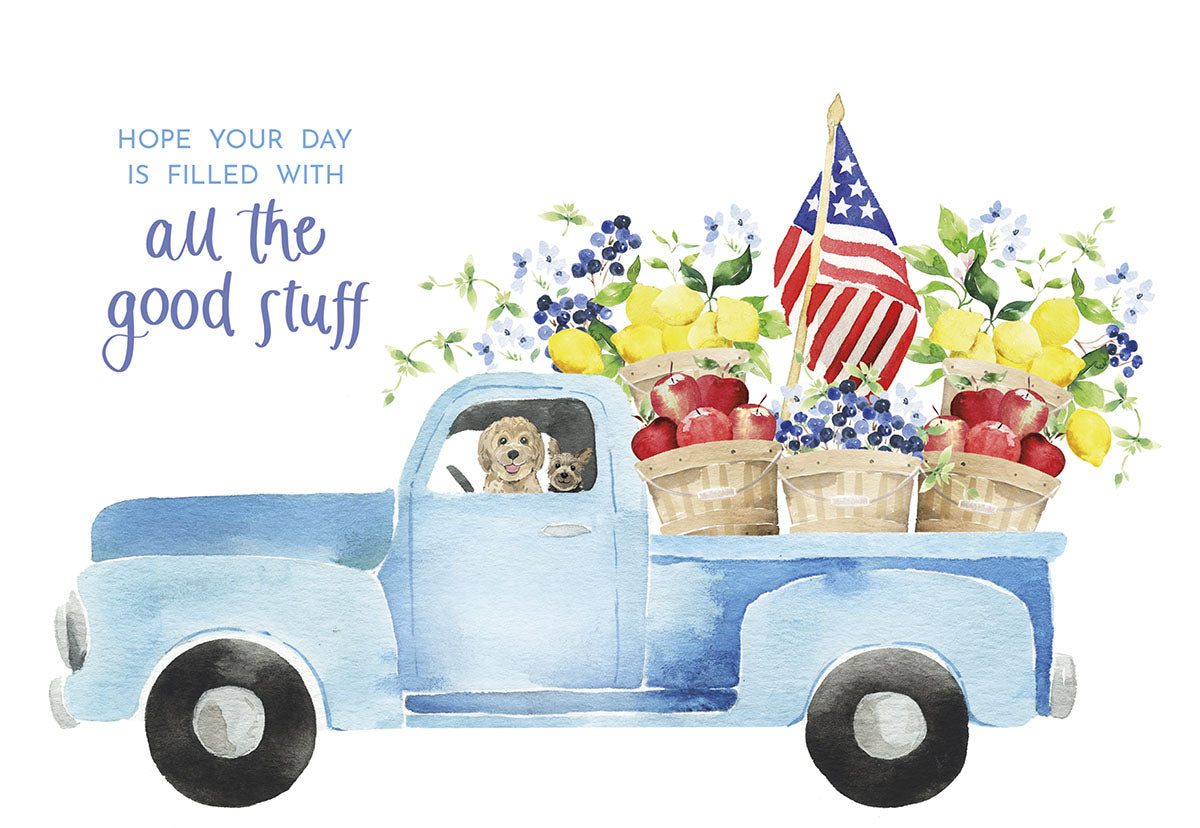 Front of greeting card with a blue pickup truck carrying fruit baskets and American flags, text "all the good stuff".