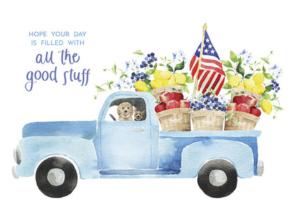 Front of greeting card with a blue pickup truck carrying fruit baskets and American flags, text "all the good stuff".
