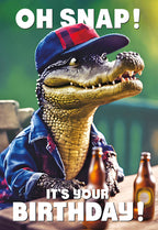 Funny crocodile wearing a backwards baseball cap and denim shirt, sitting at a rustic table with two beer bottles, text reads 'OH SNAP! IT'S YOUR BIRTHDAY!' on a vibrant outdoor background.