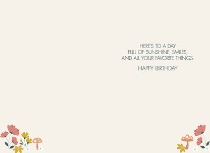 Inside of the "LET THE SUN SHINE IN" card, with flowers and mushrooms, text: "HERE'S TO A DAY FULL OF SUNSHINE, SMILES, AND ALL YOUR FAVORITE THINGS. HAPPY BIRTHDAY".