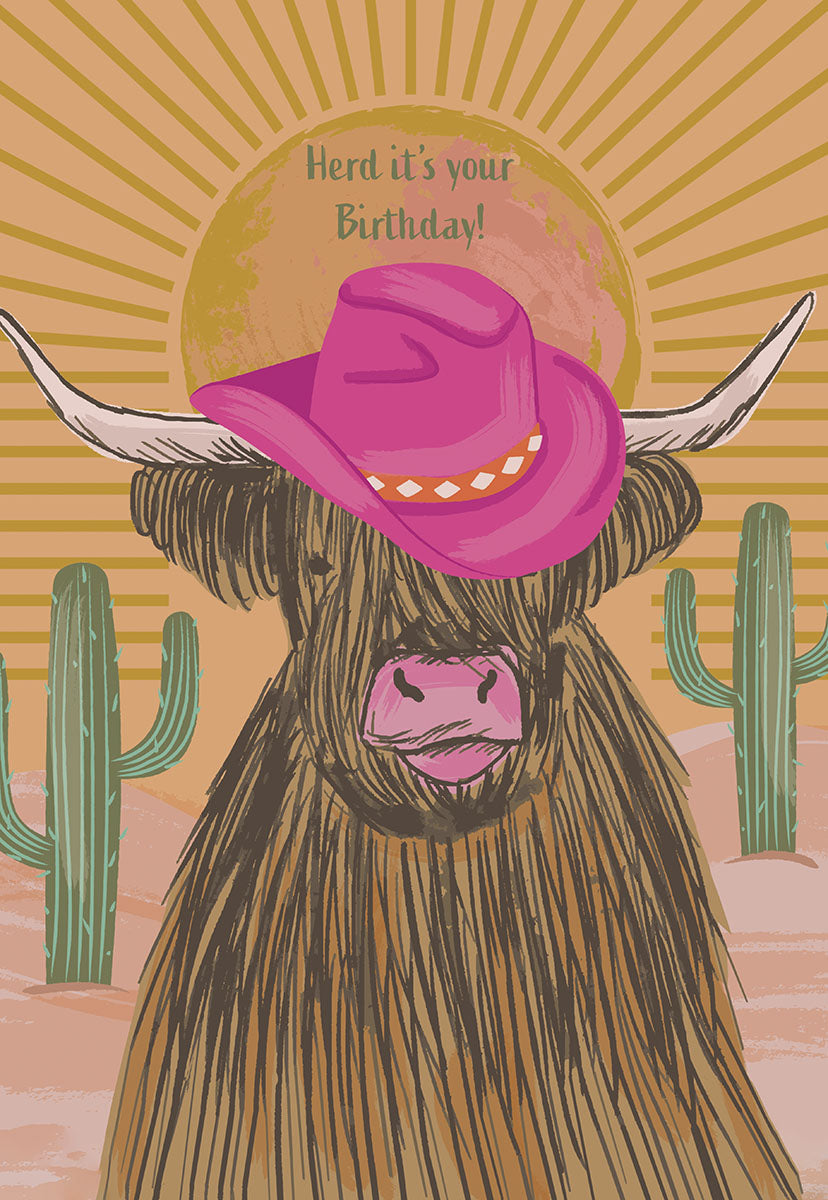 Front of a card with a shaggy cow wearing a pink cowboy hat, text "Herd it's your Birthday!" with cacti in background.