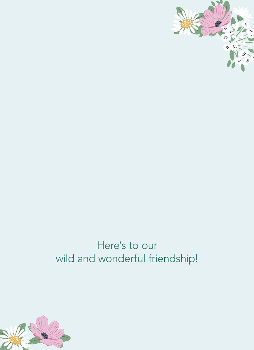 Inside of the "COWGIRLS AT HEART" card, with floral corners, text: "Here's to our wild and wonderful friendship!".