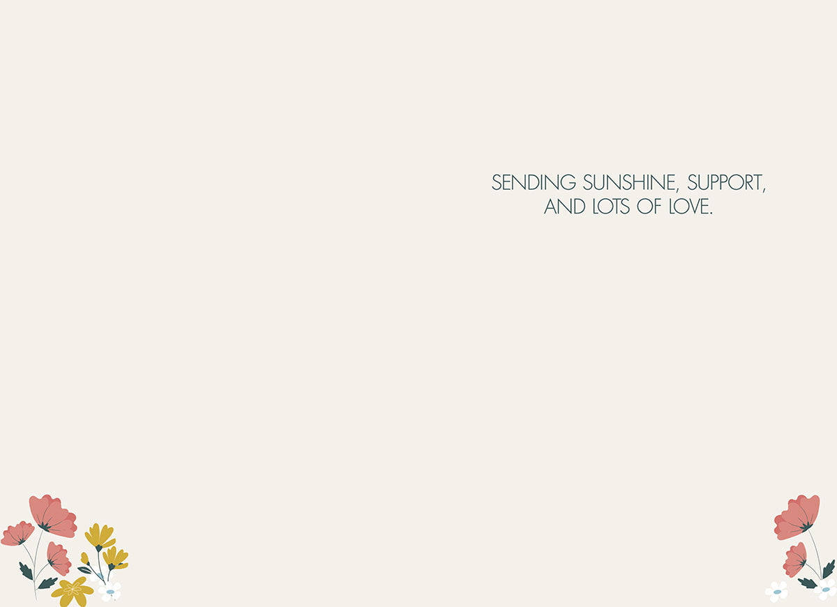 Inside of the "BLOOM WITH GRACE" card, with small floral accents, text: "SENDING SUNSHINE, SUPPORT, AND LOTS OF LOVE.".