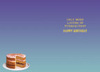 Inside view of a humorous greeting card with a purple to blue gradient background, showing a small image of a cake slice at the bottom. The central golden text reads 'ONLY MORE LAYERS OF PURRFEECTION! HAPPY BIRTHDAY', conveying a witty message for a special occasion.