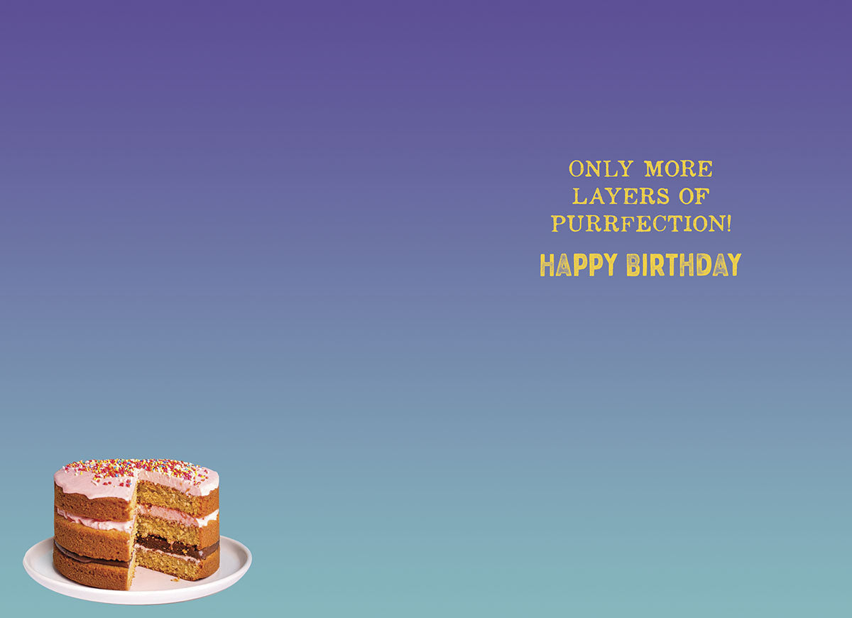 Inside view of a humorous greeting card with a purple to blue gradient background, showing a small image of a cake slice at the bottom. The central golden text reads 'ONLY MORE LAYERS OF PURRFEECTION! HAPPY BIRTHDAY', conveying a witty message for a special occasion.