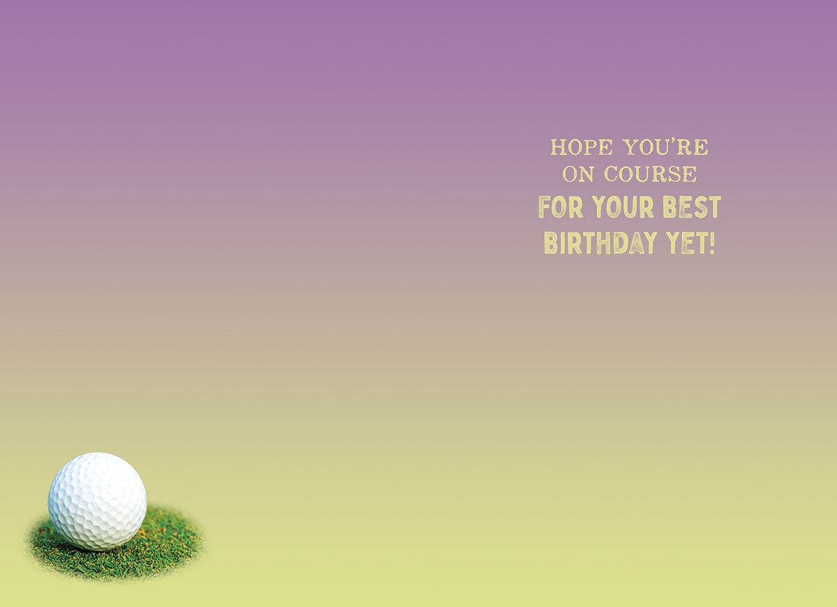 Inside of a lighthearted golf-themed greeting card with a purple and green gradient background. A golf ball sits on a patch of grass in the bottom left corner, and the text reads 'HOPE YOU'RE ON COURSE FOR YOUR BEST BIRTHDAY YET!'