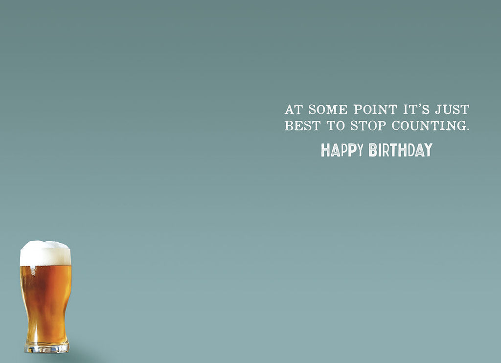 Inside of a humorous birthday card with a serene light blue background, showing a partial view of a beer glass and the witty punchline 'AT SOME POINT IT'S JUST BEST TO STOP COUNTING. HAPPY BIRTHDAY', ideal for a lighthearted adult birthday message.