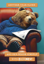 Funny greeting card featuring a sleeping bear in an armchair with glasses and a newspaper, sarcastically stating 'Another year older and he's beside himself with excitement,' perfect for milestone celebrations for him.