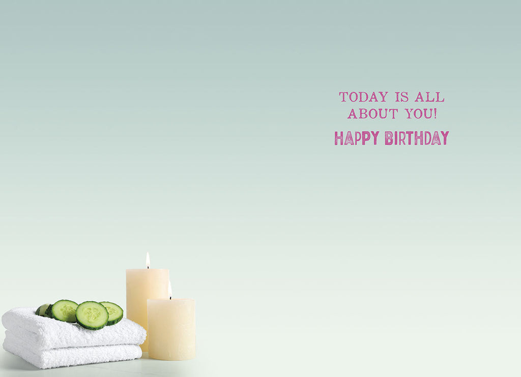 Inside of a serene birthday card with a light blue-green gradient background. Text in pink reads 'TODAY IS ALL ABOUT YOU! HAPPY BIRTHDAY'. White rolled towels with cucumber slices and lit candles are in the foreground.