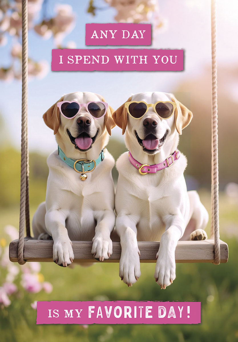 Two happy Labrador dogs wearing pink and yellow heart-shaped sunglasses, sitting on a wooden swing under blooming trees. The card reads: "ANY DAY I SPEND WITH YOU IS MY FAVORITE DAY!"