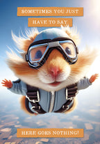 SEO-optimized alt description for the front of an encouragement greeting card featuring a cute fluffy hamster in skydiving goggles and a blue jumpsuit, mid-air, with text 'SOMETIMES YOU JUST HAVE TO SAY HERE GOES NOTHING!' against a blue sky with ground below. Ideal for someone starting a new challenge.