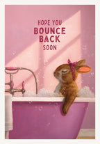 Cute bunny in a pink bubble bath with a polka dot headscarf, a 'Hope You Bounce Back Soon' greeting card. Ideal for someone recovering or needing a cheerful lift.