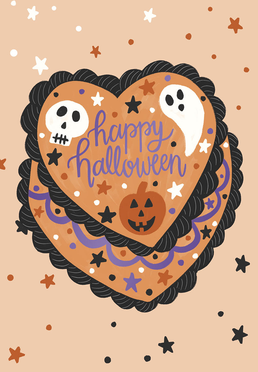 Cute heart-shaped greeting card with happy Halloween cake design featuring a friendly ghost, smiling pumpkin, and playful skull on a light peach background with stars and dots.