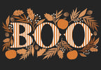 Front of a black Halloween greeting card with large white striped "BOO" text, adorned with autumn leaves, orange pumpkins, and acorns, perfect for friends.