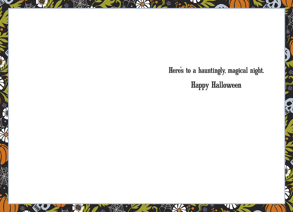 Inside view of a lighthearted Halloween greeting card for a friend, showing a blank white writing space on the left and a pre-printed message on the right: 'Here's to a hauntingly, magical night. Happy Halloween.' The card's edges are adorned with a border matching the front design of pumpkins, flowers, and spiderwebs.