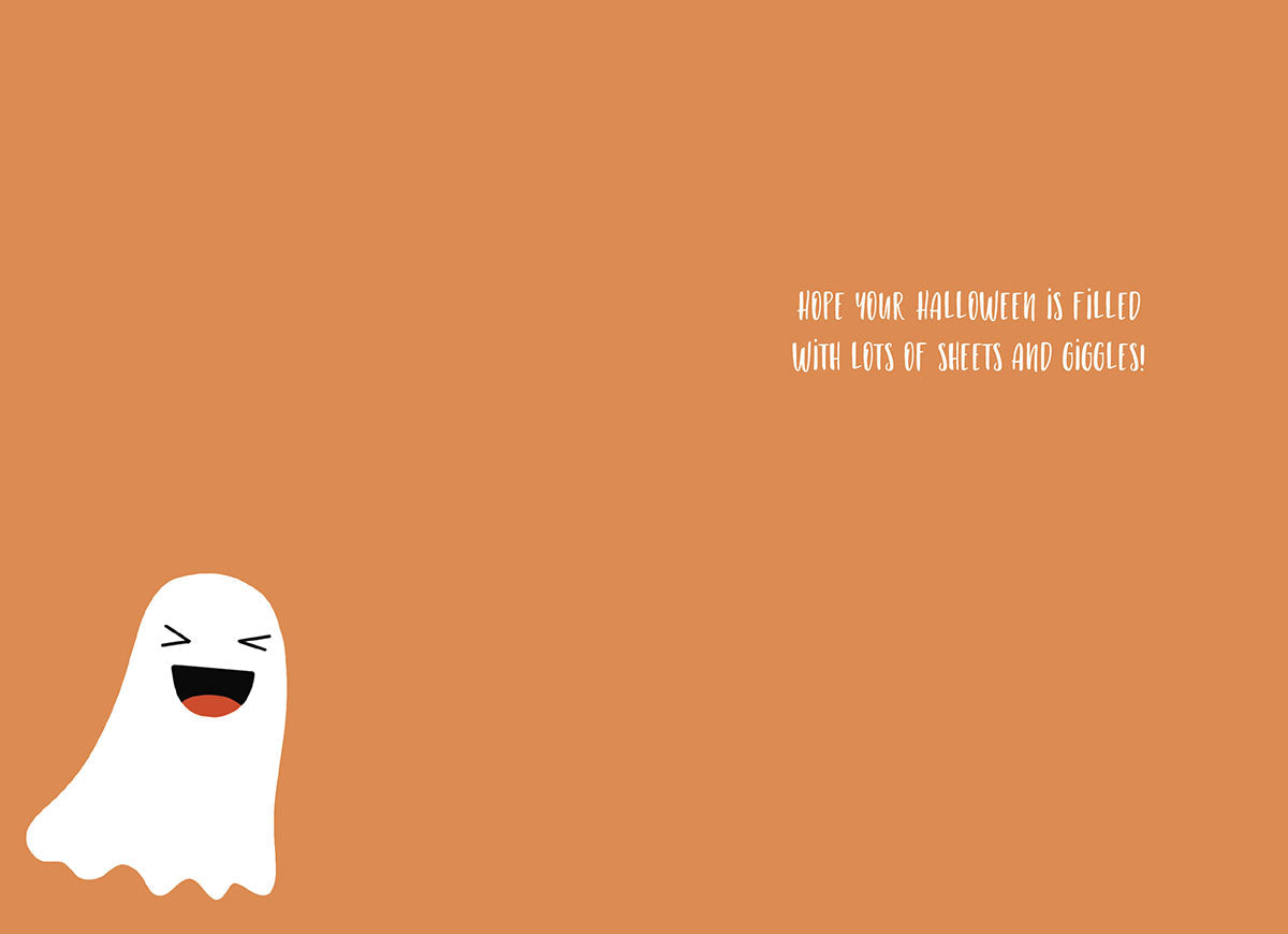 Inside of a cute ghost Halloween card with a single smiling cartoon ghost and a punny message: 'HOPE YOUR HALLOWEEN IS FILLED WITH LOTS OF SHEETS AND GIGGLES!' on an orange background.