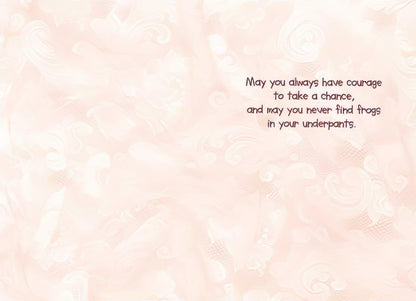 Inside of a Maggie Mae card with swirling patterns and text 'May you always have courage to take a chance, and may you never find frogs in your underpants'.