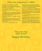 Close-up of a birthday greeting card detailing historical events from 1969 with a 'What was happening?' section and 'Happy Birthday' message.