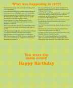 Detailed text inside a 'Year of Birth' greeting card listing historical facts and cultural events from 1977, including best-selling vehicles, movie releases, musical artists, and the caption 'You were the main event! Happy Birthday'.