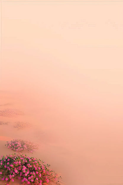A soft gradient background from light pink to peach, with pink desert flowers blurred in the lower left corner.