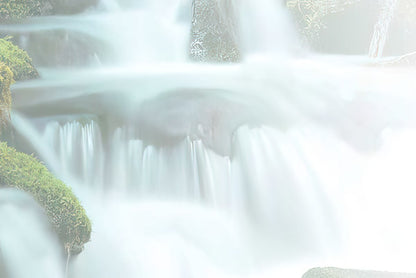 Soft, blurred white and light green background, evoking the movement and texture of a flowing waterfall.