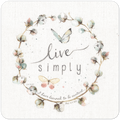 Watercolor 'Live Simply' coaster featuring a cotton wreath, two graceful butterflies, and the scripture 'I have learned to be content... Phil 4:11 NKJV'. Ideal drinkware for peaceful, Christian home decor.