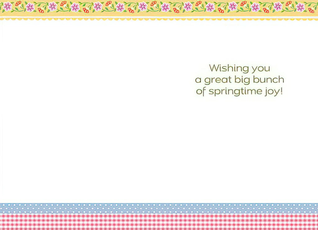 Inside of a simple white Easter greeting card displaying the message 'Wishing you a great big bunch of springtime joy!' centered on the right panel. The card features a decorative border mirroring the front, with small colorful flowers, blue polka dots, and a red and white gingham check pattern.