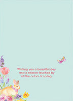 Inside of a charming spring greeting card with a sweet message: 'Wishing you a beautiful day, and a season touched by all the colors of spring,' adorned with a watercolor bunny, flowers, and a butterfly in the corner.