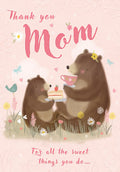 Cute Mother's Day greeting card featuring an illustration of a mama bear and cub sharing tea and strawberry cake in a pastel pink floral meadow, with 'Thank you Mom' message.