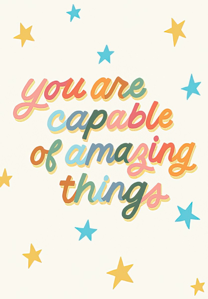 Front of an inspiring graduation greeting card featuring colorful text 'You are capable of amazing things' surrounded by gold and blue stars on a light cream background, perfect for celebrating success.